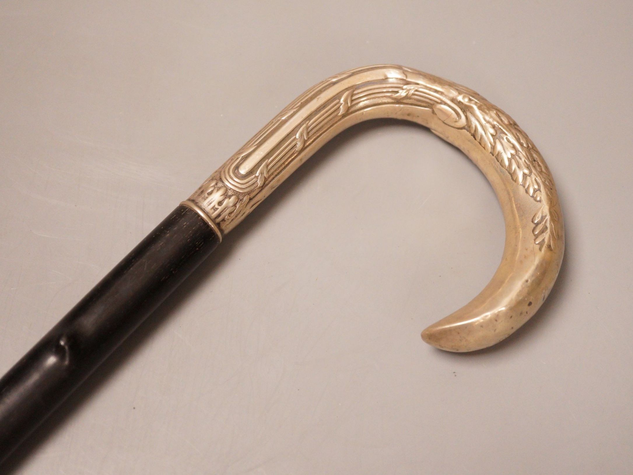 An 800 stamped white metal handled walking stick, 93cm long